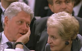 (FILES) In this file photo taken on November 18, 1999 US President Bill Clinton (L) listens to US State Secretary Madeleine Albright at the Ciragan Palace in Istanbul
