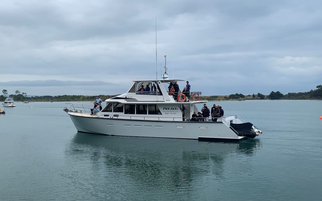 A boat carrying the families of those missing on Whakaari / White Island has been welcomed back to the mainland.