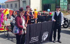 Greymouth District Youth Trust/Art Soup float for the 2022 Greymouth Christmas Parade. Pictured: Rātā Gurney, Hannah Hsieh (on the bike), Fred Struve, Theo Struve
