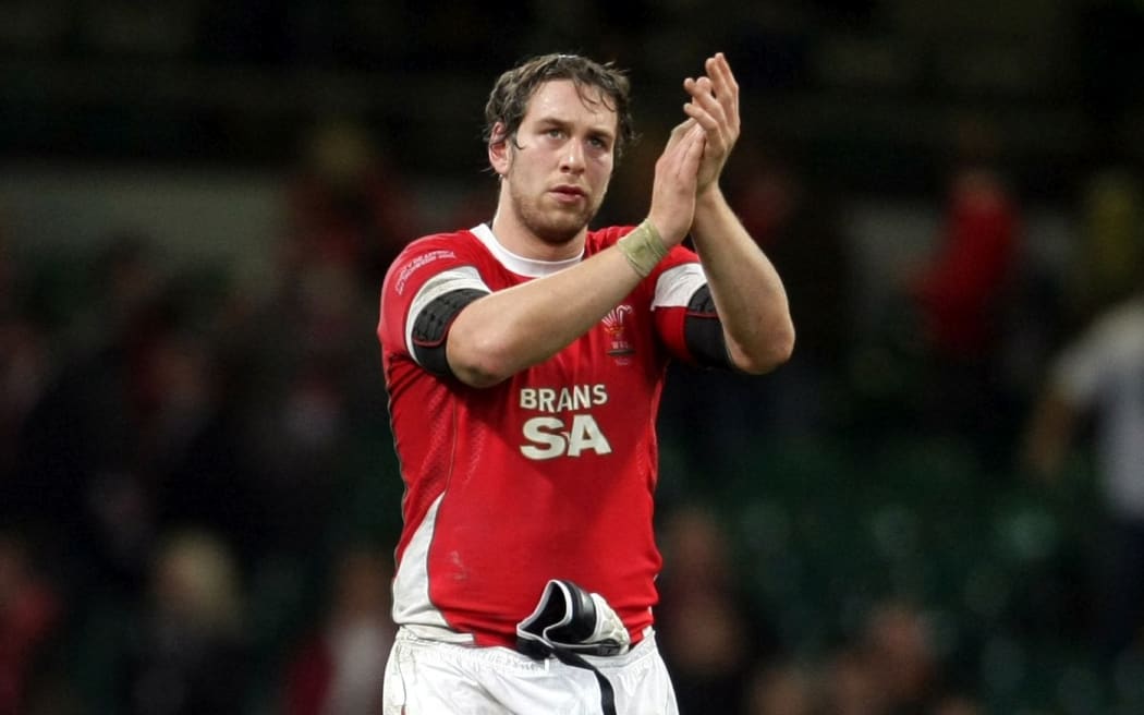 A dissapointed Wales captain Ryan Jones applauds the fans in 2008.