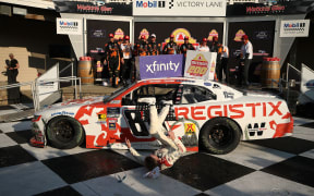 Connor Zilisch slips and falls off his car after winning the NASCAR Xfinity Series' latest race.
