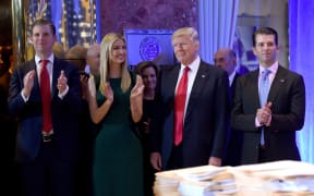 (FILES) In this file photo taken on January 11, 2017, US President-elect Donald Trump along with his children Eric (L), Ivanka and Donald Jr., arrive for a press conference January 11, 2017 at Trump Tower in New York.