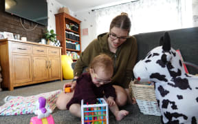 Julia Tiffen plays with her mother Nikita at their Palmerston North home.