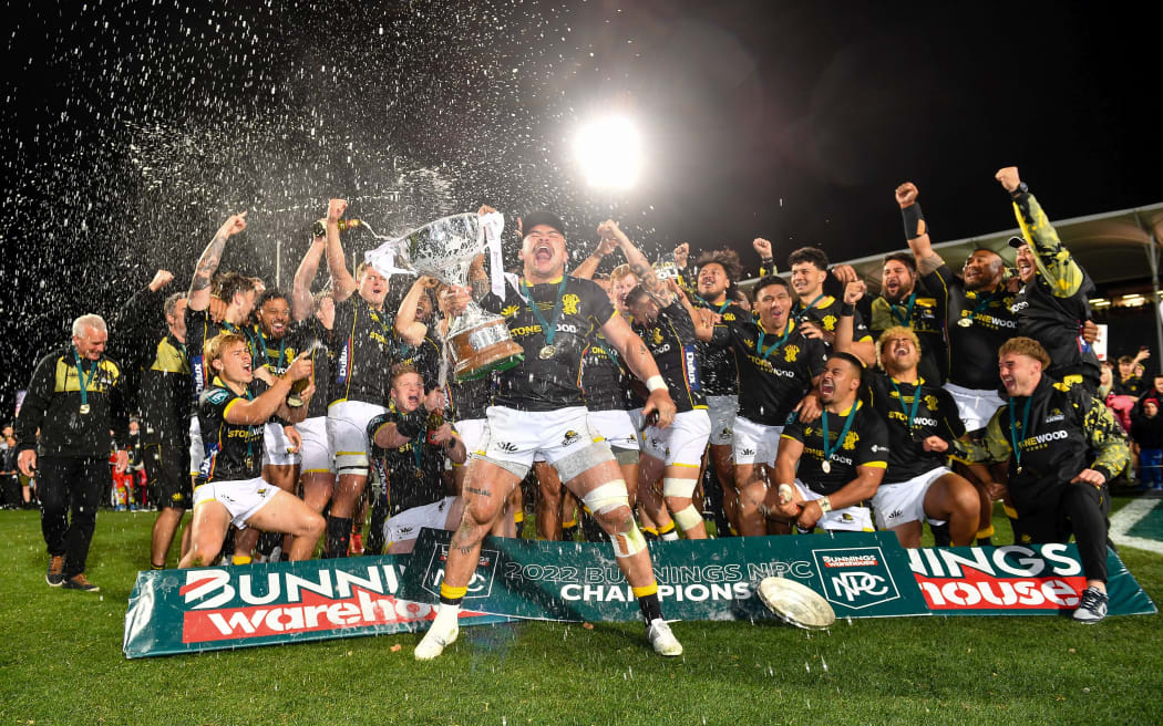 Wellington captain Du'Plessis Kirifi holds the cup up after winning the NPC Rugby Final with victory over Canterbury, 2022.