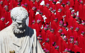 Saint Peter's statue and cardinals during the funeral ceremony of Pope Francis at Saint Peter's Square in Vatican on 26 April, 2025.