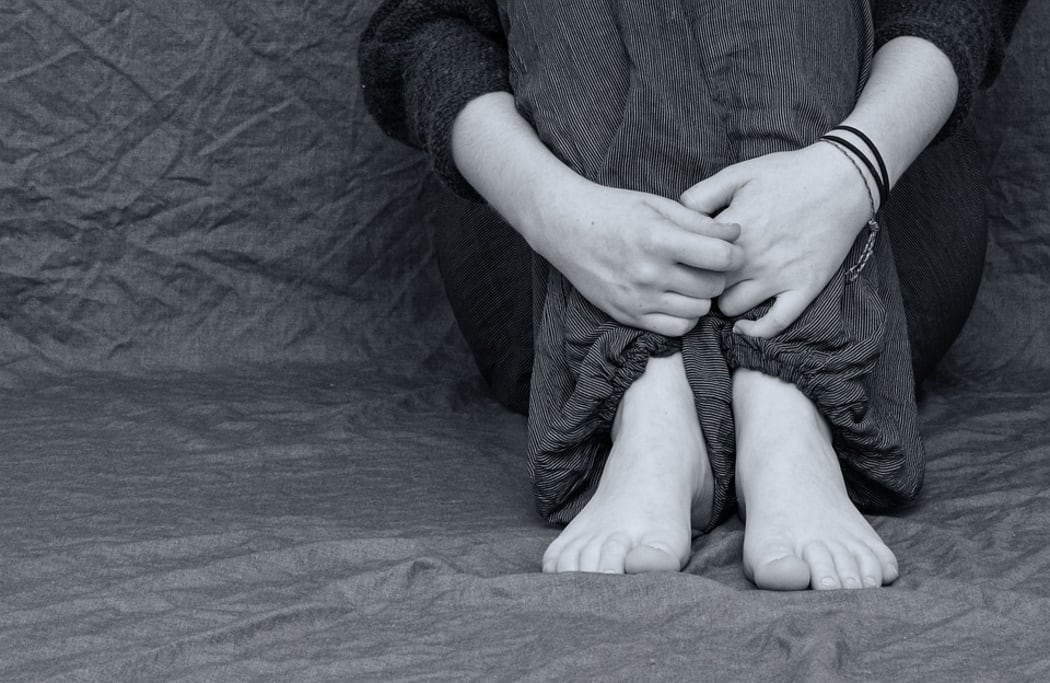 Person sitting on floor