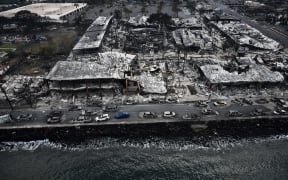 An aerial image taken on August 10, 2023 shows destroyed buildings on the waterfront burned to the ground in Lahaina in the aftermath of wildfires in western Maui, Hawaii.
