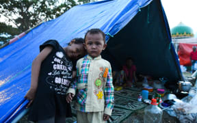 Tents have been set up on a field of a mosque for people to take refuge in Palu, Indonesia's Central Sulawesi.