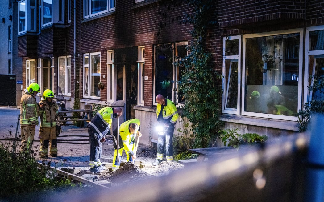 ROTTERDAM - The police and fire brigade are investigating the building on Heiman Dullaertplein where a 32-year-old man shot a 39-year-old woman and her 14-year-old daughter. The perpetrator shot a 43-year-old man in a classroom of the Erasmus Medical Center. The three victims have died. ANP JEFFREY GROENEWEG netherlands out - belgium out (Photo by ANP MAG / ANP via AFP)