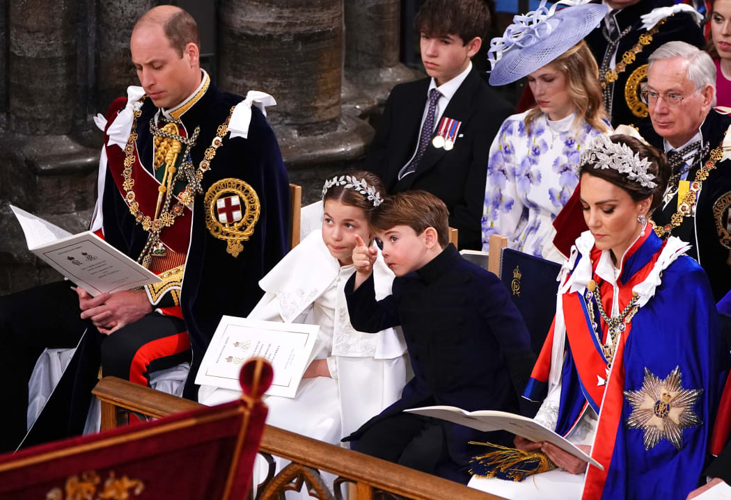 (From left) Prince William, Prince of Wales, Princess Charlotte, Prince Louis and Catherine, Princess of Wales attend the coronation of King Charles III and Camilla, Queen Consort at Westminster Abbey in central London on May 6, 2023. - The set-piece coronation is the first in Britain in 70 years, and only the second in history to be televised. Charles will be the 40th reigning monarch to be crowned at the central London church since King William I in 1066. Outside the UK, he is also king of 14 other Commonwealth countries, including Australia, Canada and New Zealand. Camilla, his second wife, will be crowned queen alongside him, and be known as Queen Camilla after the ceremony. (Photo by Yui Mok / POOL / AFP)