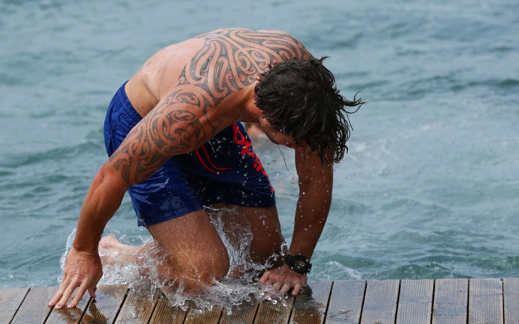 Gillies Kaka having a dip in Wellington Harbor after training.