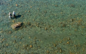 A participant in Reel Recovery and his fishing guide take on the mighty waters of the Tongariro River, near Turangi.