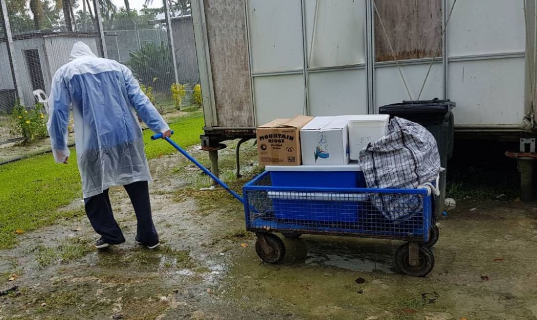 A refugee leaves Charlie compound.