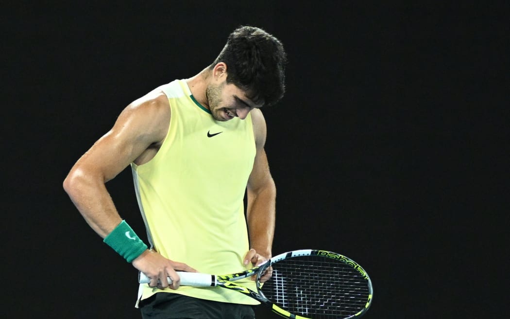 A dejected Carlos Alcaraz of Spain