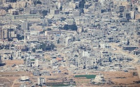 A view of the destruction ind the Gaza Strip, from a Jordanian military aircraft before the airdrop operation of aid over Gaza on 14 August, 2025.