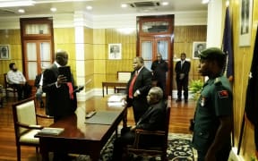 Oagile Key Dingake being sworn in