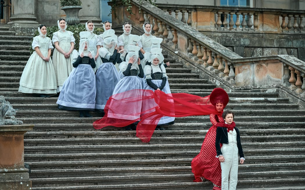 Frankenstein. Mia Goth as Clarie Frankenstein and Christian Convery as Young Victor in Frankenstein. Cr. Ken Woroner/Netflix © 2025.