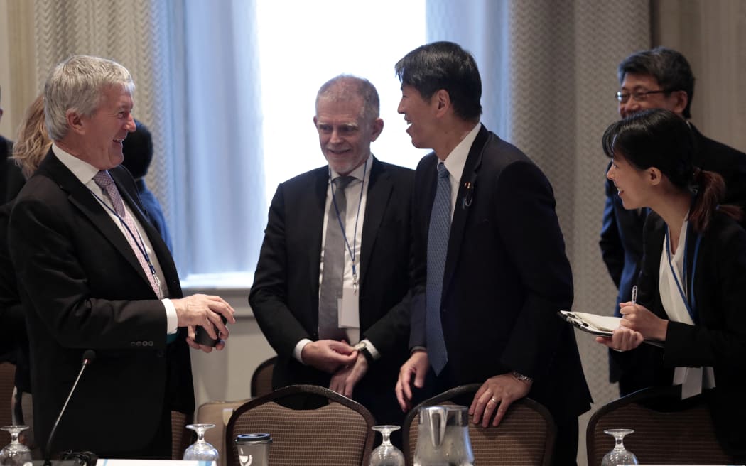 Trade and Export Growth Minister Damien O'Connor speaks with Japanese ministerial representatives before the start of the Indo-Pacific Economic Framework Ministerial meeting in Detroit, Michigan on 27 May, 2023.