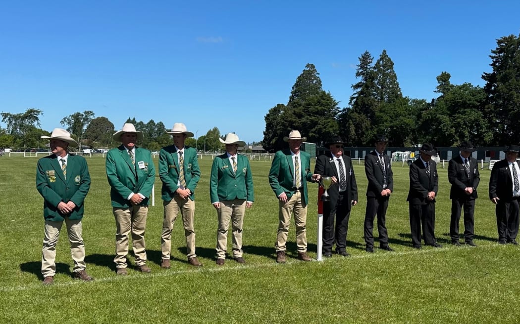 The New Zealand and Australian Teams line up before the 37th Test in sheep dog trials in Ashburton Mid Canterbury