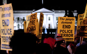 Protesters near the White House, Washington, 27 January 2023, in a rally against the fatal police assault of Tyre Nichols on 7 January.