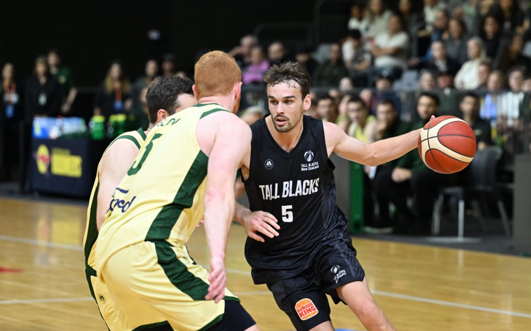 Taylor Britt runs the ball for the Tall Blacks against the Australian Boomers in the third international, at  Globox Arena, Hamilton, 11 May 2025.
