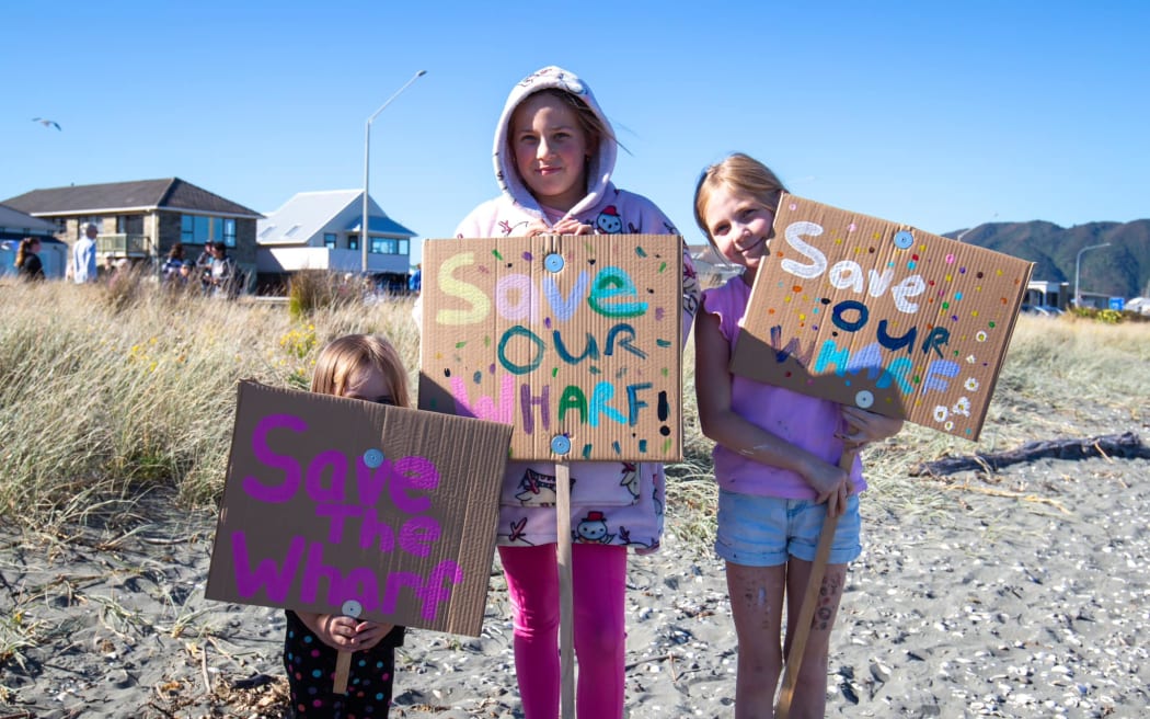 Children protesting plans to demolish Petone Wharf walk along Petone Beach 28 April 2024.