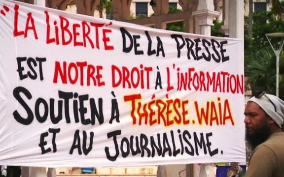 Banners supporting local journalist Thérèse Waia 24 April 2024