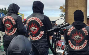 Back of head hunters gang members showing the patch