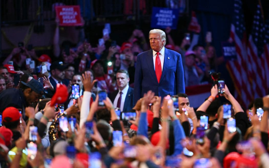 Former US President and Republican presidential candidate Donald Trump arrives to speak during a campaign rally at Madison Square Garden in New York, October 27, 2024. (Photo by ANGELA WEISS / AFP)
