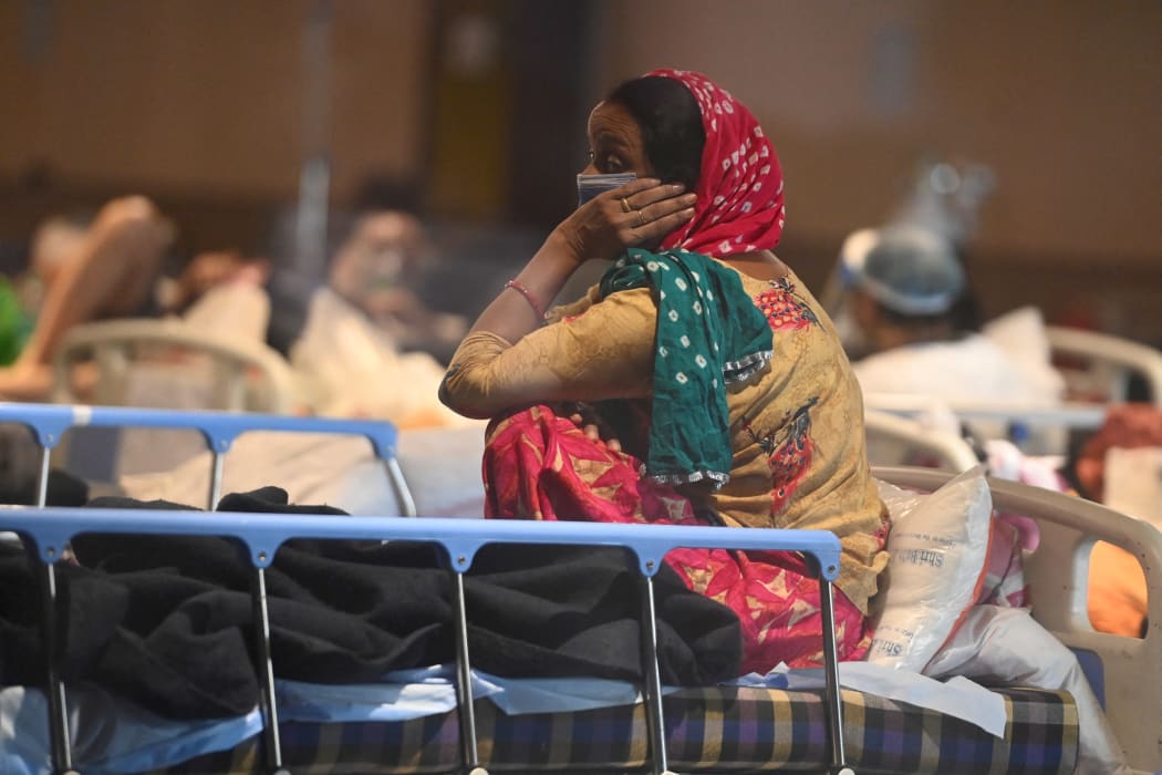 A patient rests inside a banquet hall temporarily converted into a Covid-19 ward in New Delhi on April 27, 2021.