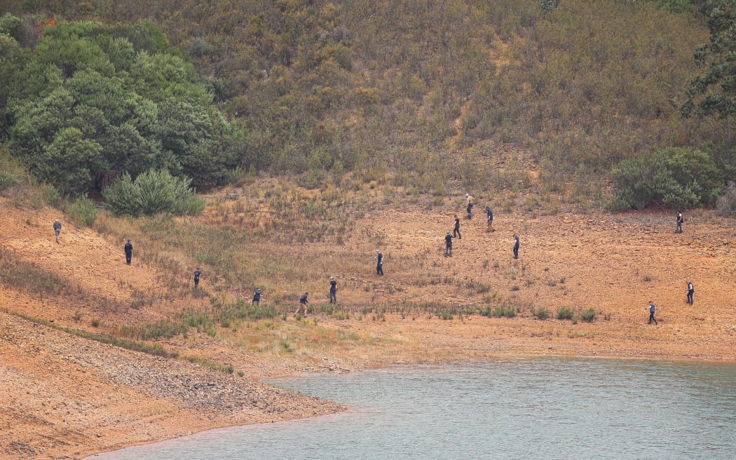 Portuguese authorities from the Judicial Police criminal investigation unit work during a new search operation amid the investigation into the disappearance of Madeleine McCann at the Arade dam, in Silves, near Praia da Luz, on 23 May, 2023.