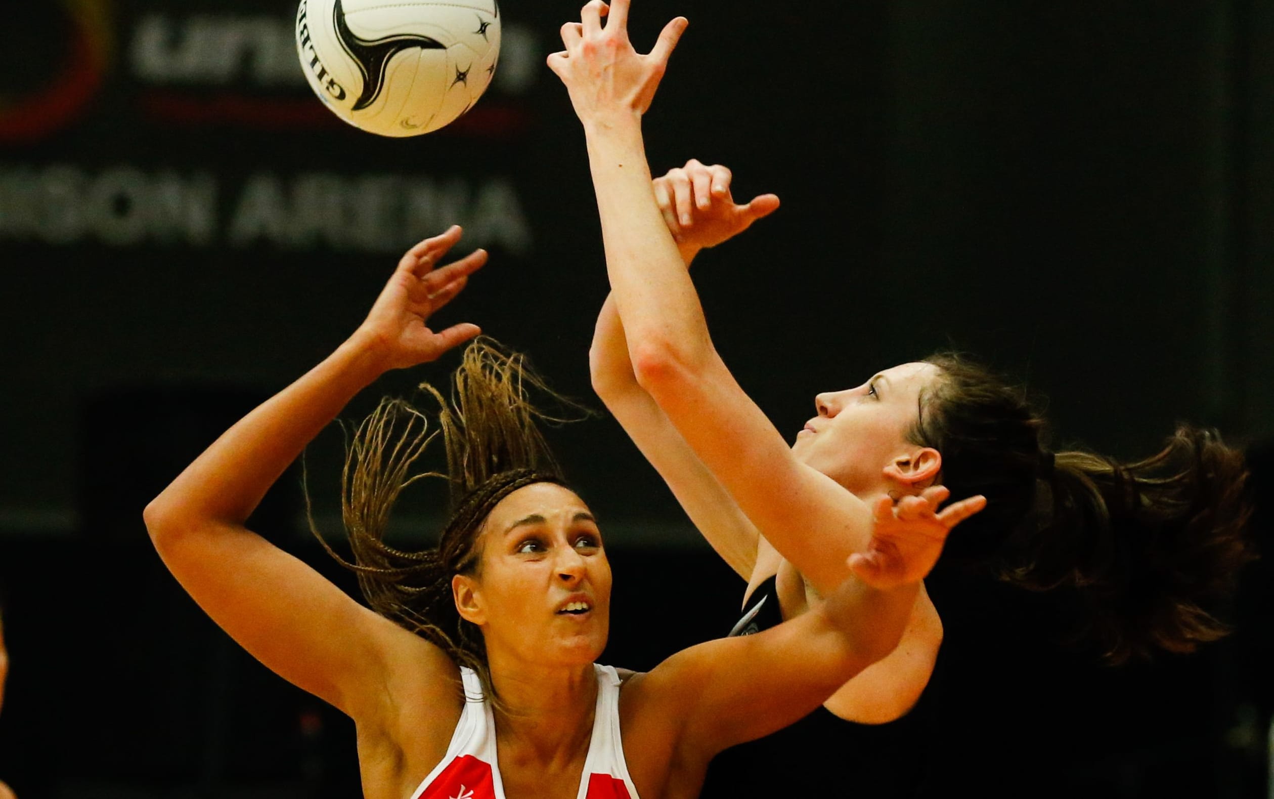 England's Geva Mentor and Silver Fern Bailey Mes clash in Rotorua in 2014.