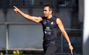 Carlton Aussie Rules player Eddie Betts gestures as he trains with teammates in Melbourne on June 30, 2020. Australian Rules teams came together to take a knee in support of the "Black Lives Matter" movement, but ongoing racist attacks show there's still work to do.  This month veteran Eddie Betts, in his 16th season, was depicted as a monkey in a Twitter post on the very weekend all teams united in support of Black Lives Matter. (Photo by William WEST / AFP) / --IMAGE RESTRICTED TO EDITORIAL USE - NO COMMERCIAL USE--