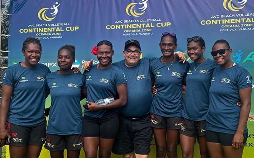 Icomply chief executive officer Rodney Prestia (middle) with Vanuatu beach volleyball players who work for Icomply in Brisbane. Photo: Icomply