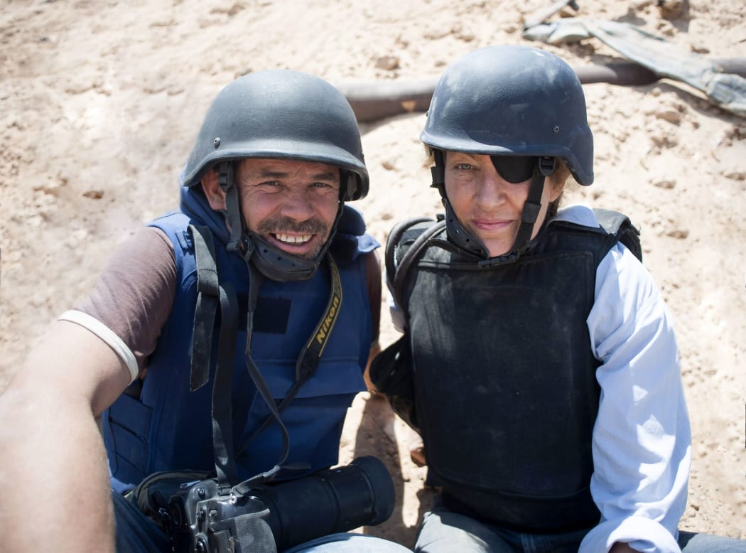 Paul Conroy and Marie Colvin in the field