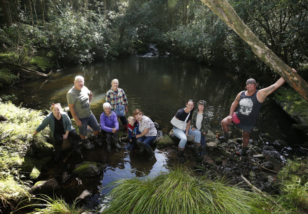 Val Faulkner (fourth from left) at Patuwairua Stream with (from left) Anne-Marie Franks, Mike Franks, Lynda Franks, Theo Taylor, Wendy Taylor, Izzy Whitehead, Ryan Whitehead and Sam Whitehead.