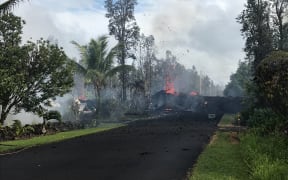Fissure at Leilani and Kaupili Streets in Leilani Estates subdivision. Lava on the road was approximately 2 m thick.