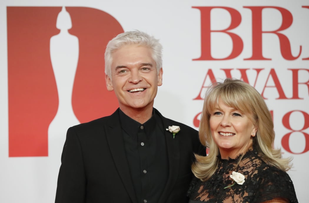 British television presenter Phillip Schofield and his wife Stefanie Lowe, at the BRIT awards in 2018.