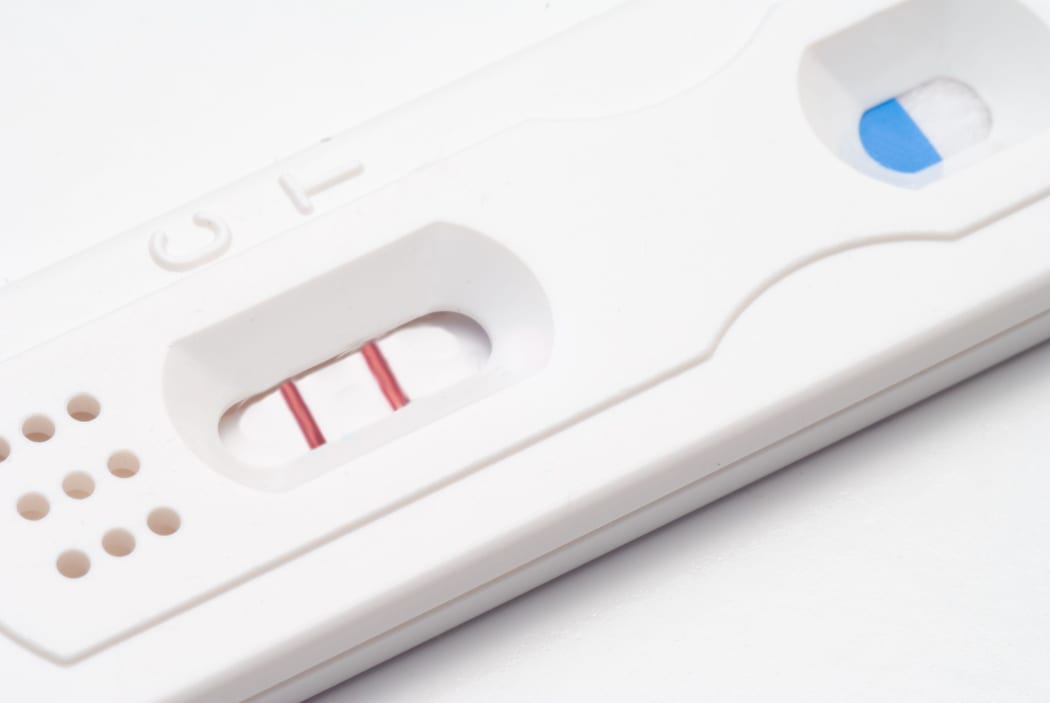 A home pregnancy test showing a positive result.