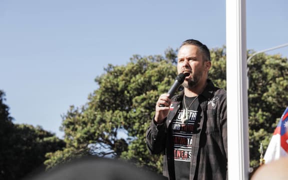 Te Pati Maori MP Tākuta Ferris speaks to a crowd of protestors outside Parliament