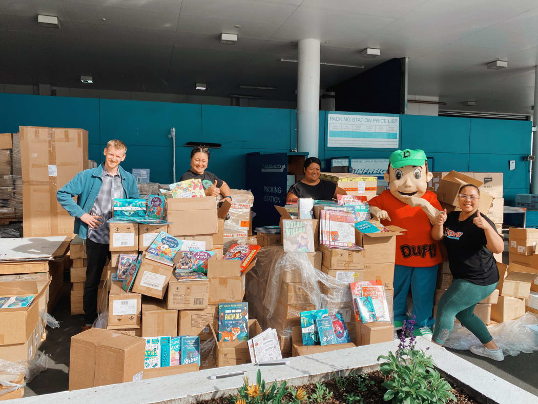 The team at Duffy Books in Homes organizing 6000 children's books to provide to children and families across Aotearoa.