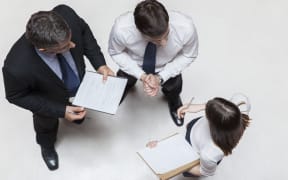 Executives in meeting, overhead view
