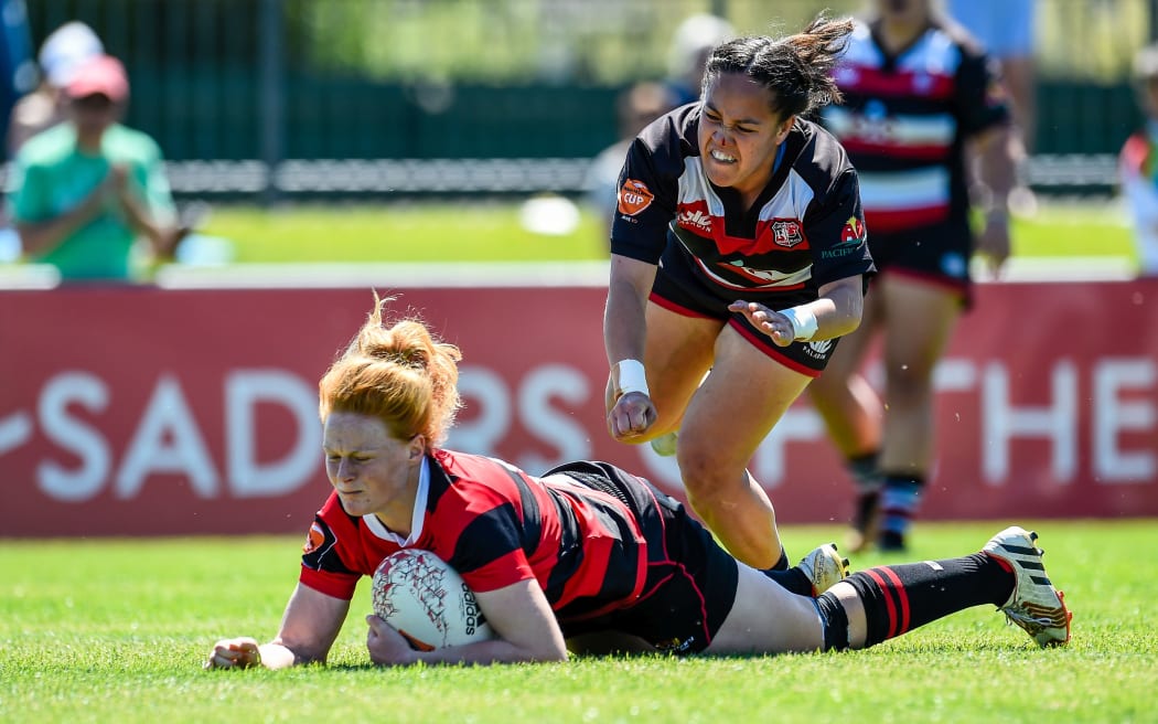 Grace Brooker of Canterbury scores a try
