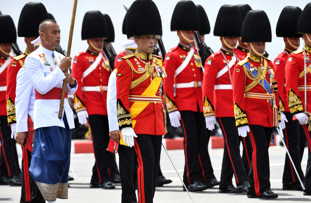 Thai King Maha Vajiralongkornm front left, takes part in the funeral procession.