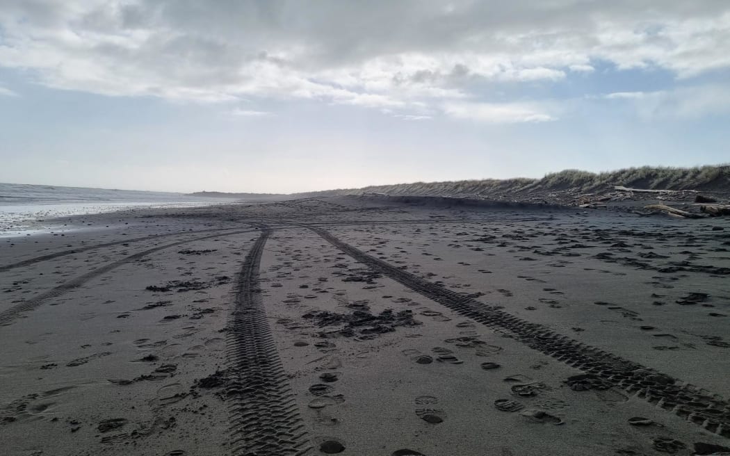Police vehicle tracks on Fitzroy Beach where a body was found on Monday morning.