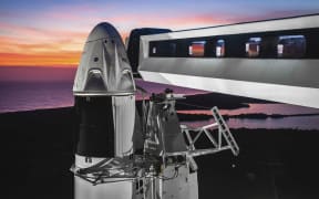 The Dragon crew capsule atop a Falcon 9 rocket at the launch pad at Kennedy Space Center in Florida.