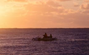 Fishing at sunset off Mangaia, Cook Islands