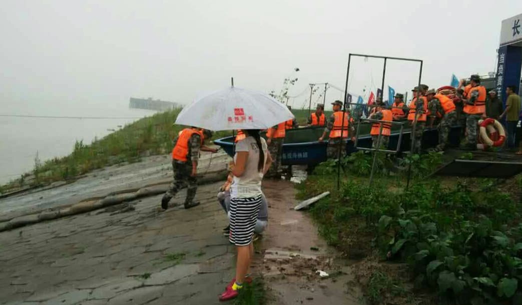 Rescuers work near the ship sinking site in the Jianli section of the Yangtze River in central China's Hubei Province