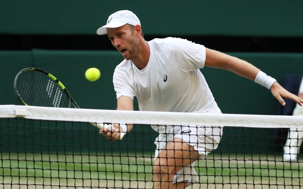 Michael Venus plays a drop shot during the final of the men's doubles at Wimbledon.