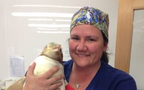 Dr Lisa Argilla with one of the hoiho.